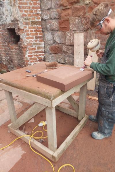 A stone mason working at Carlisle Castle