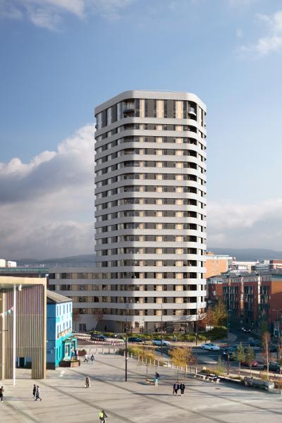 Tall tower with grey horizontal bands and windows.  