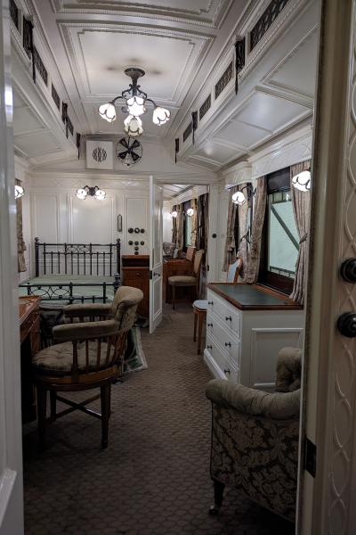 Train carriage interior of a Edwardian bedroom.