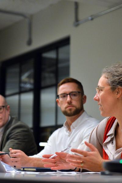 People talking around a table.