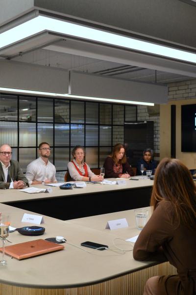 People in discussion around a table.
