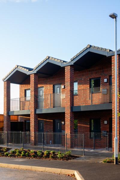 A view of the scheme from across the road during morning hours.
