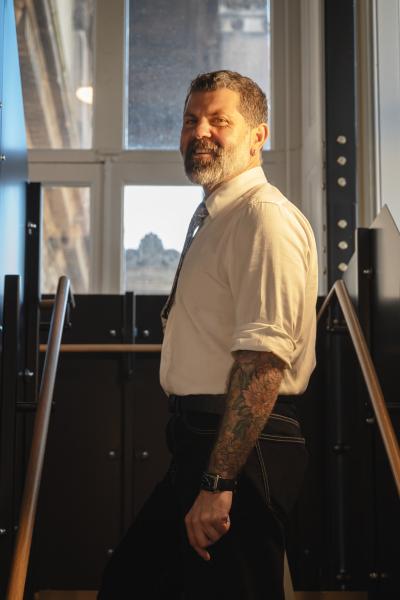 A man in a white shirt looking at the camera. 