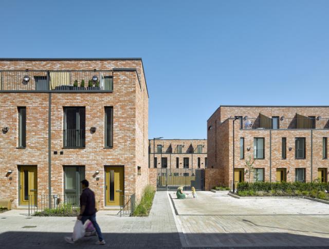 street view of terracotta coloured valette square residential buildings