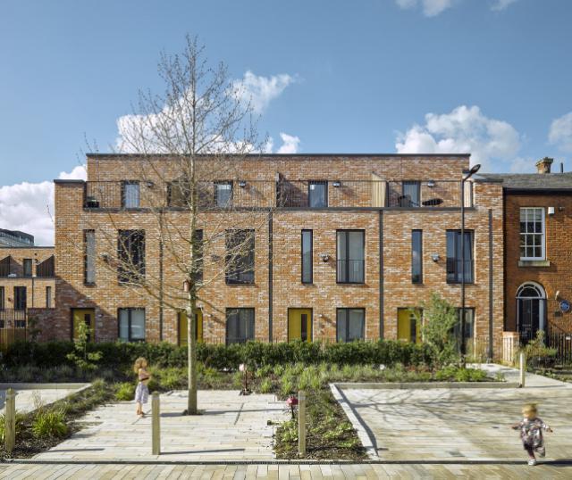 street view of terracotta coloured valette square residential buildings