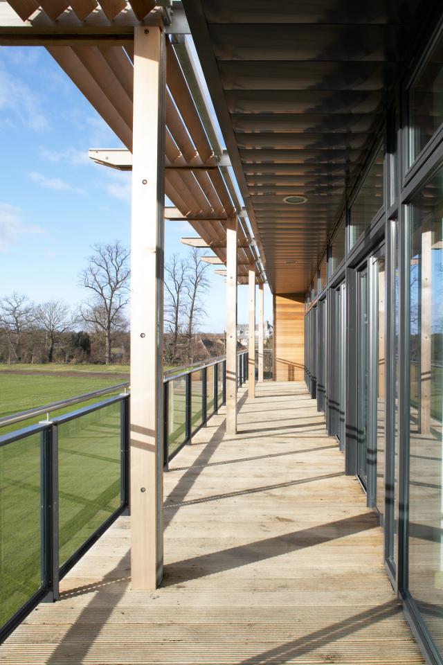 Image of a balcony overlooking an outdoor sports pitch.