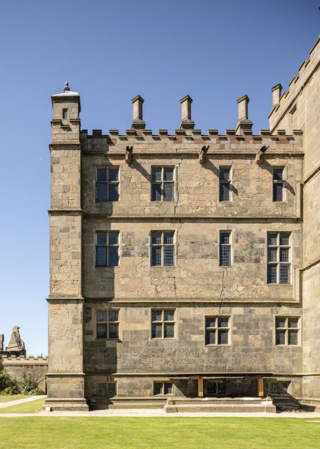 Exterior image of a Grade I listed castle with contemporary rainwater canopy.