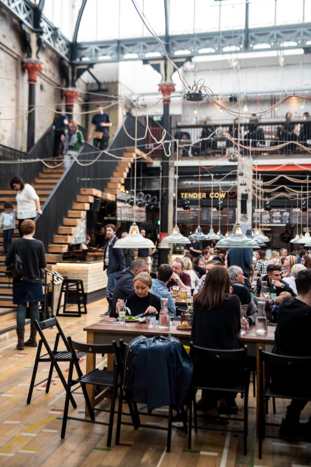 People eating in a dining hall.