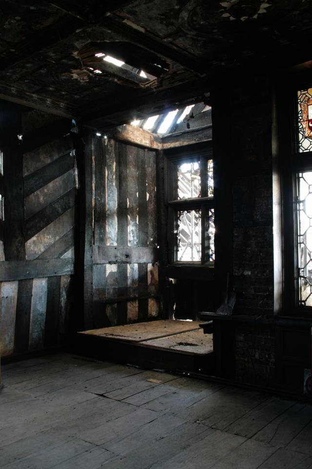 Interior of a 16th century manor house. The building is severely fire damaged.
