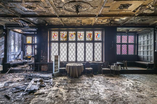 Interior of a 16th century manor house. The building is severely fire damaged.