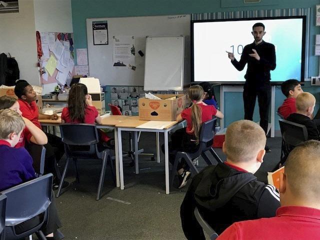adam lewis teaching a classroom