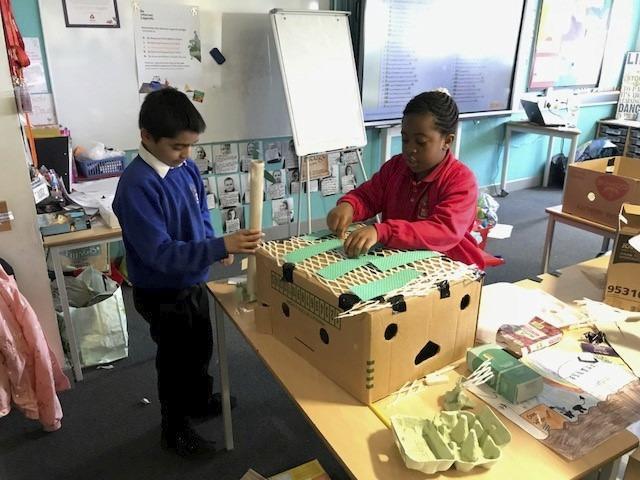 two children interacting at workshop