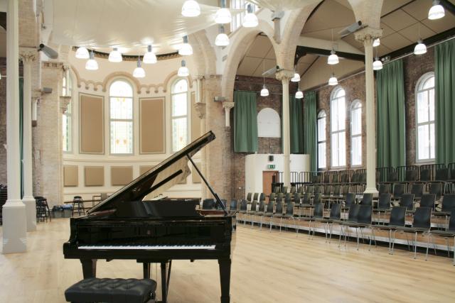 interior of halle st peters, piano and rows of chairs