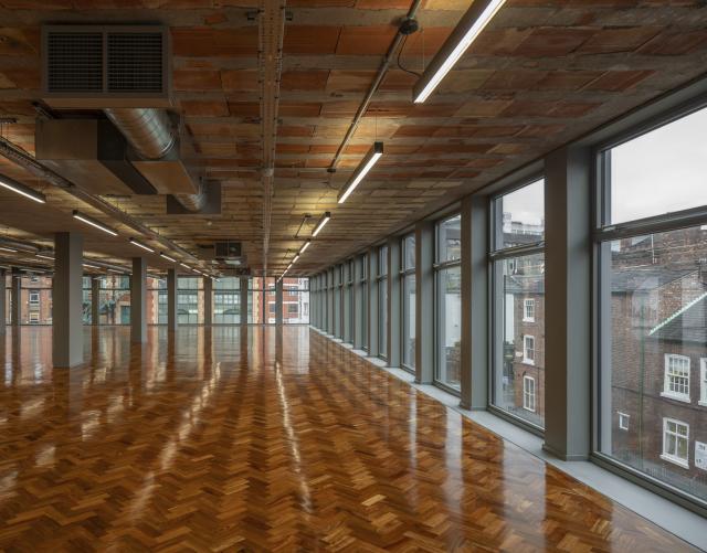 Interior of hilton house workspace, polished wood floors, vacant space