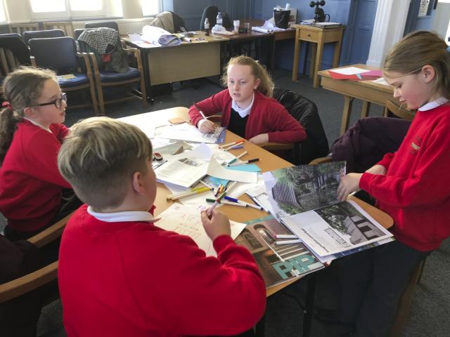students at maryport workshop around table