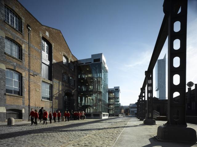 exterior of MSI great western warehouse, with pupils walking along