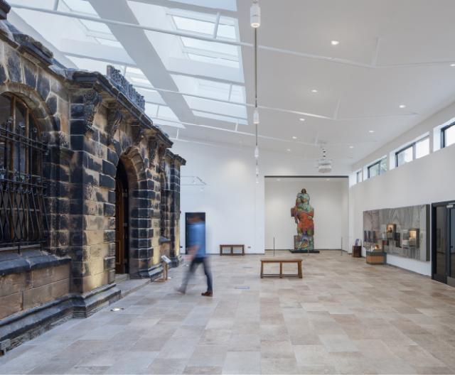 interior of norton priory, heritage statement wall, large foyer space and sky lights