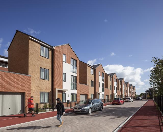 Exterior image of a row of new build houses.