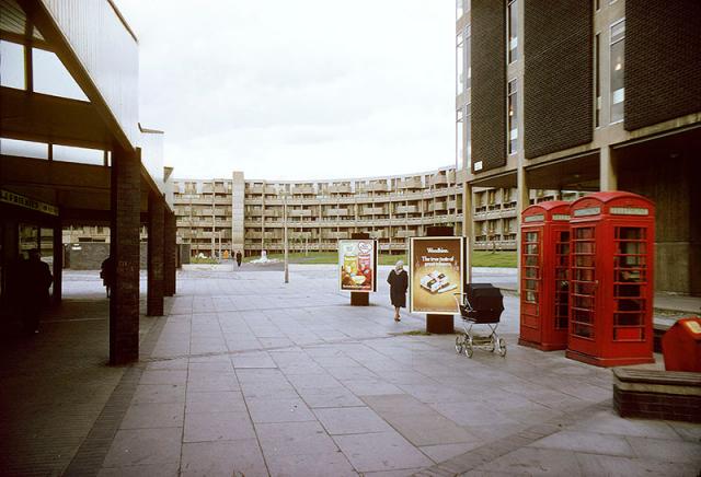 An image of a 'crescent' residential development in Hulme, Manchester.