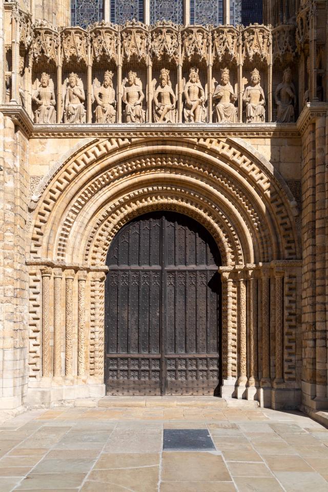 Exterior photo of medieval stone carvings on a cathedral