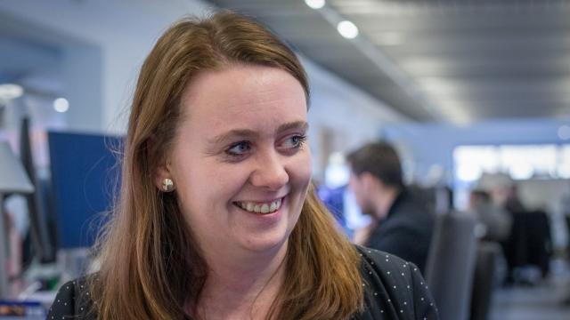 headshot of lucy ashcroft, looking off to side smiling