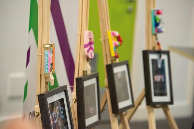 side shot of small framed art on easels