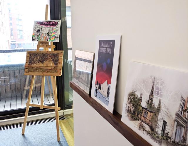 various art canvases in studio, two on one easel