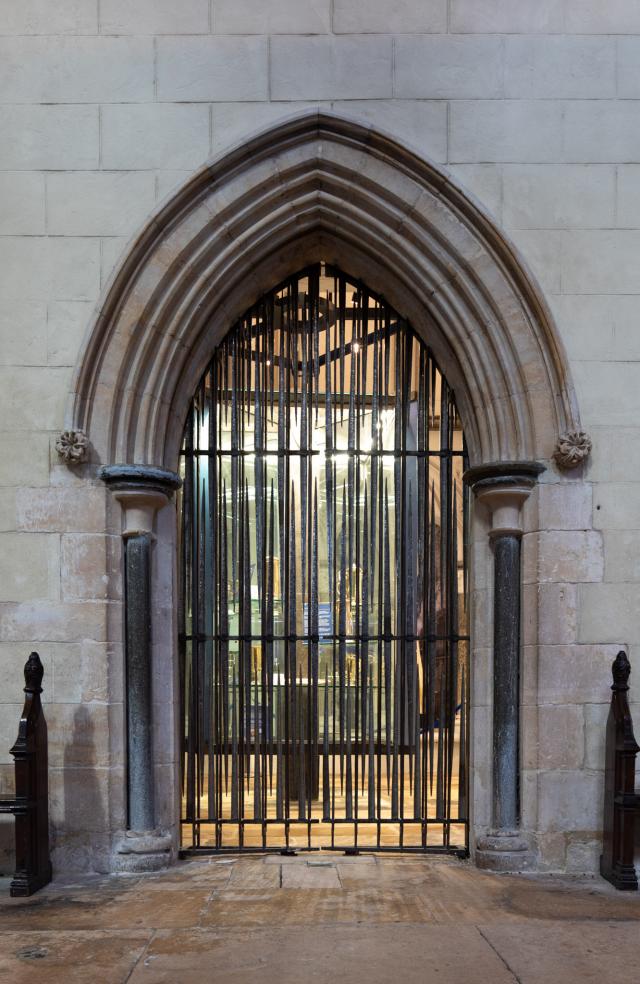 gated archway in lincoln cathedral with grid