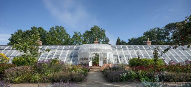exterior of quarry bank conservatory surrounded by greenery