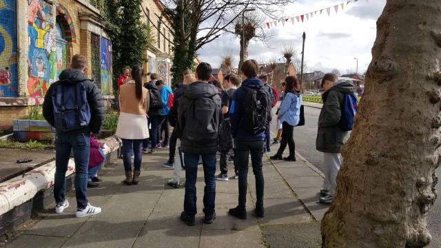 group of people gathered in street