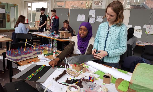 two people interacting over arts and crafts activity