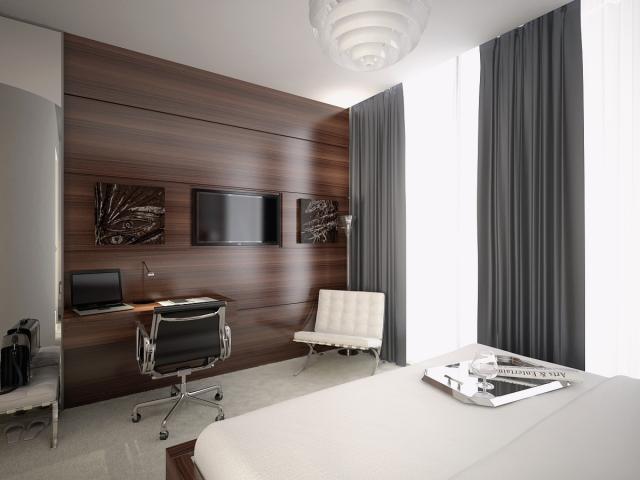 a room interior with a dark glossy wooden wall and white leather chair