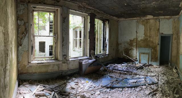 the dilapidated interior of a building