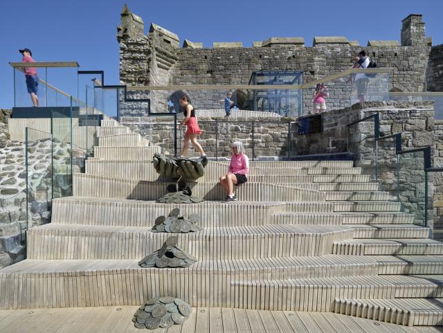 people enjoying the interpretation at Caernarfon Castle King's Gate