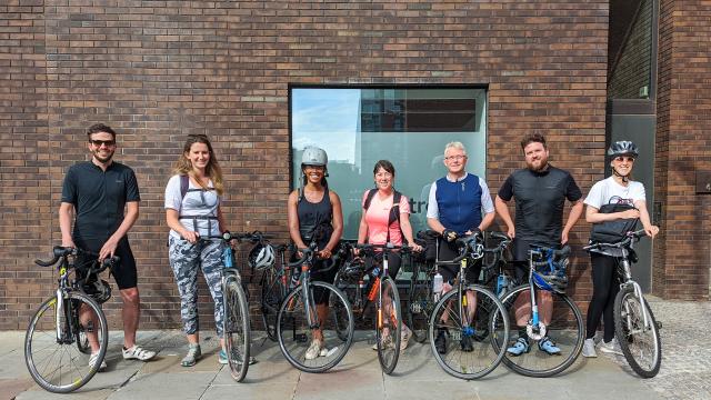 A group shot of some of the Buttress team with their bikes outside the Ancoats, Manchester studio.