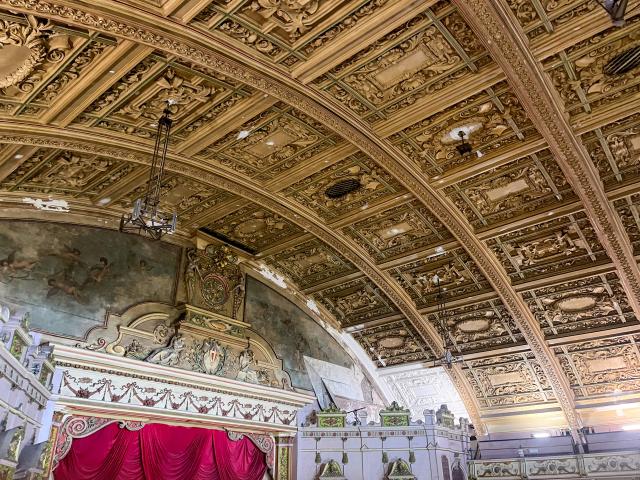Picture of the gold detailed roof of the interior of Morecambe Winter Gardens main theatre hall.