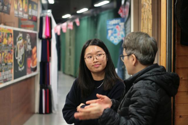 Two people engaging in conversation