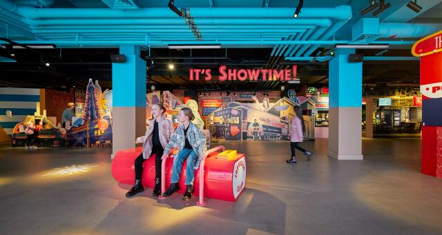 Seating at Showtown, a bright visual exhibit