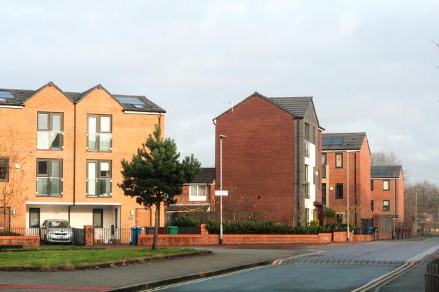 Brunswick - an inner city neighbourhood of red brick houses and a green space.