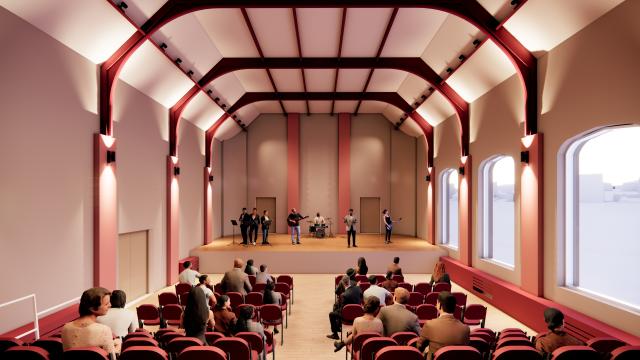 CGI visual of a perfromance space. People in rows of seats facing the stage.