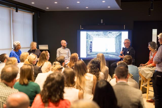 Audience facing panellists and presentation