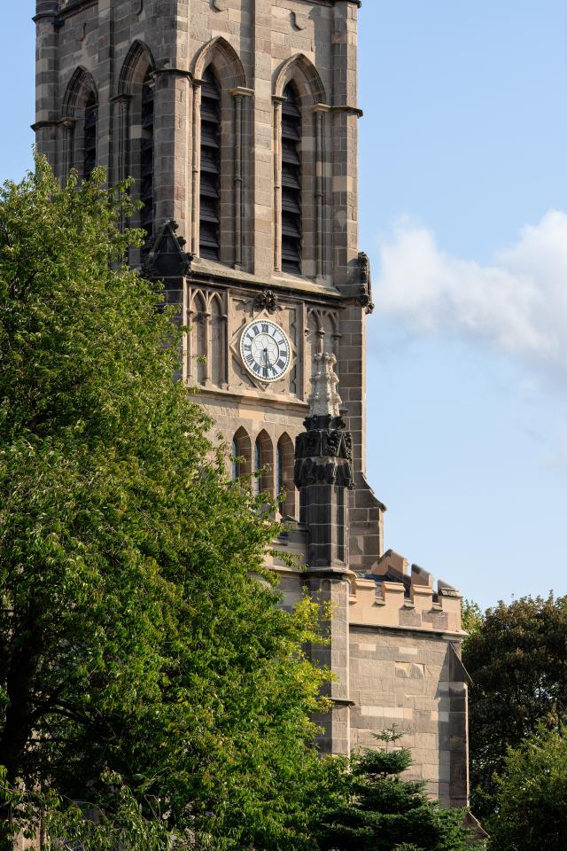 Exterior of St Mark's church - a traditional stone tower with a clock