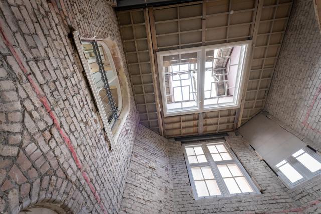 A close up view looking up to a roof light inside a brick building
