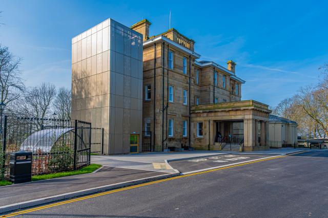 A view of Buile Hill Mansion from the front, showcasing the entrance and stairs